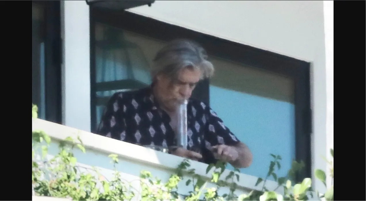 P. Kevin Morris was spotted smoking from a bong outside his Los Angeles home on 20th July, 2023. via @MALIBUUSTARS YOUTUBE / BACKGRID