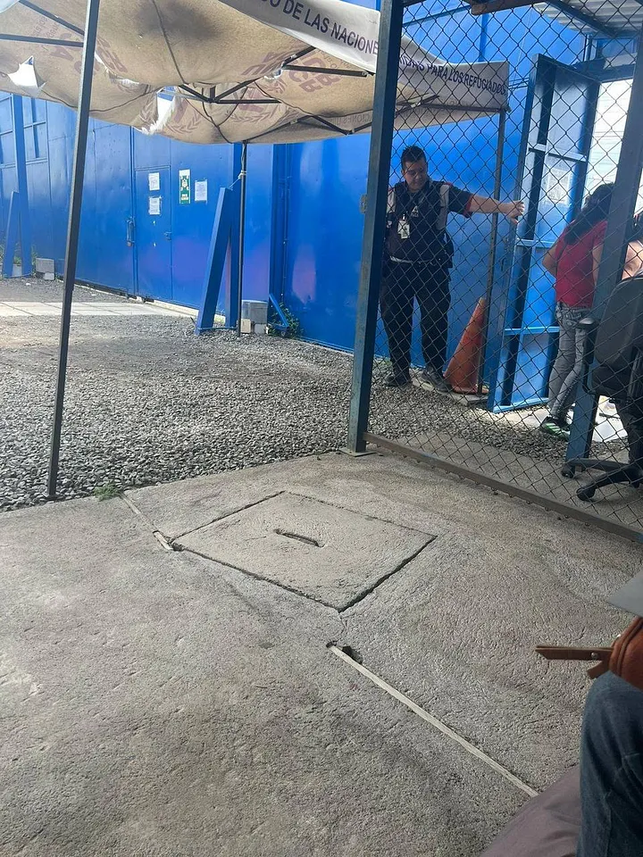 Pictured here, a "forbidden" photo taken by Marc inside the refugee processing center, and the eventually approved 'provisional refugee status'.