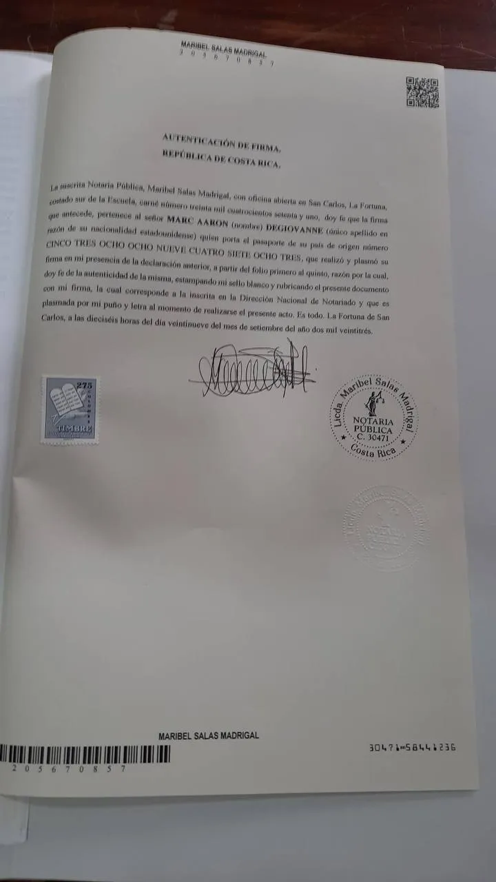 Pictured here, a "forbidden" photo taken by Marc inside the refugee processing center, and the eventually approved 'provisional refugee status'.